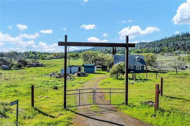 exterior space with a yard and a rural view
