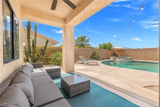 43475 Brahea Ct, Indio, CA 92201 - view of swimming pool with an outdoor living space, a fenced backyard, ceiling fan, a patio, and a pool with connected hot tub