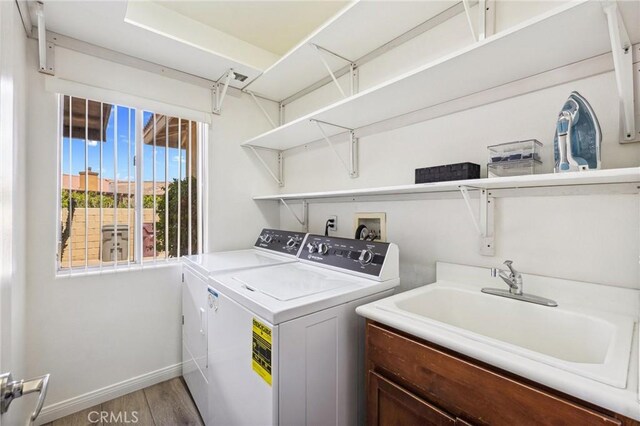 43475 Brahea Ct, Indio, CA 92201 - laundry room with light wood-style floors, independent washer and dryer, and baseboards