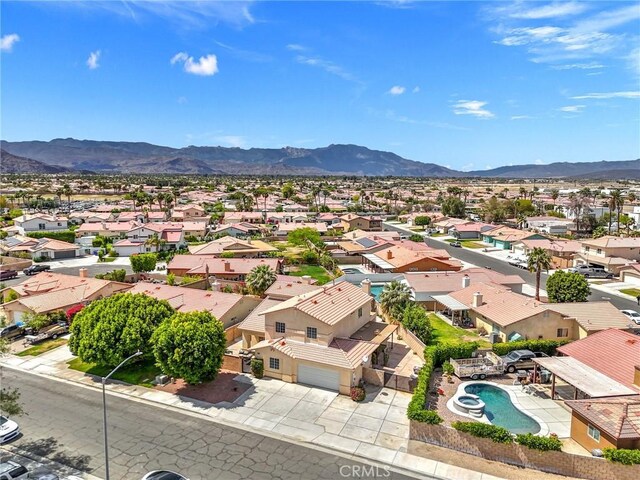 43475 Brahea Ct, Indio, CA 92201 - aerial perspective of suburban area with mountains and a pool