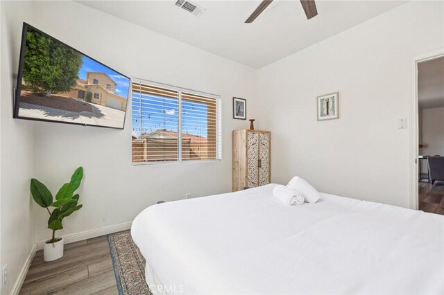 43475 Brahea Ct, Indio, CA 92201 - bedroom featuring wood finished floors, baseboards, and a ceiling fan