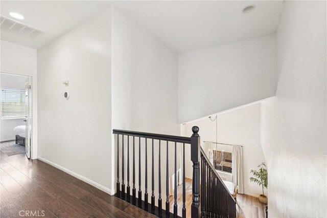 43475 Brahea Ct, Indio, CA 92201 - corridor with an upstairs landing, wood finished floors, and baseboards