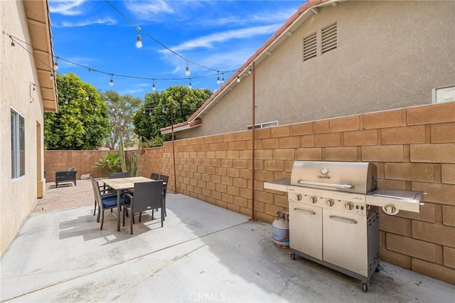 43475 Brahea Ct, Indio, CA 92201 - fenced backyard with a patio area, area for grilling, and outdoor dining area