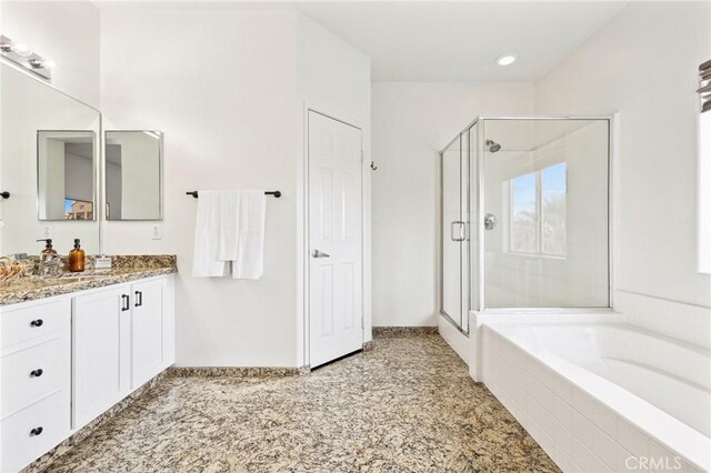 43475 Brahea Ct, Indio, CA 92201 - full bathroom featuring a stall shower, a garden tub, and vanity