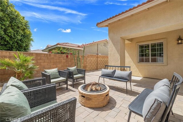 43475 Brahea Ct, Indio, CA 92201 - view of patio featuring an outdoor living space with a fire pit