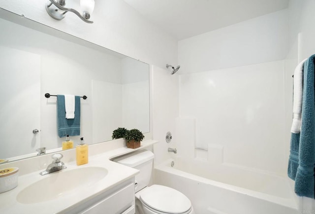 bathroom featuring washtub / shower combination, toilet, and vanity