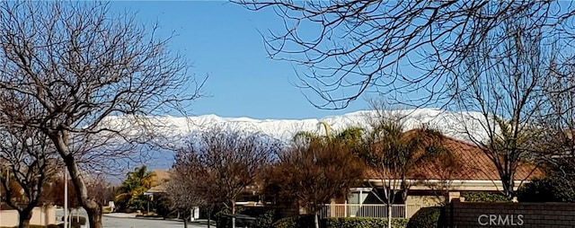exterior space featuring a mountain view and curbs