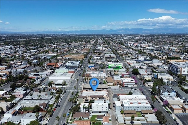 drone / aerial view featuring a mountain view