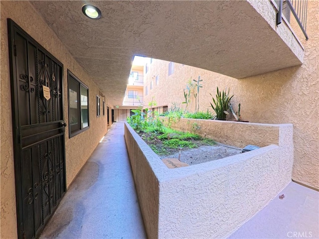 exterior space featuring stucco siding and a balcony