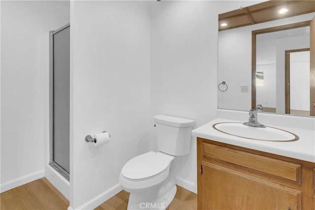 7650 Cristobal Ave, Atascadero, CA 93422 - bathroom with vanity, a stall shower, wood finished floors, and recessed lighting