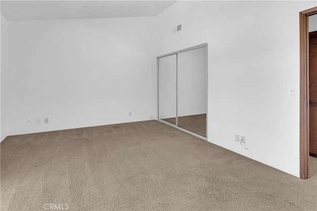 7650 Cristobal Ave, Atascadero, CA 93422 - unfurnished bedroom with carpet, lofted ceiling, and a closet