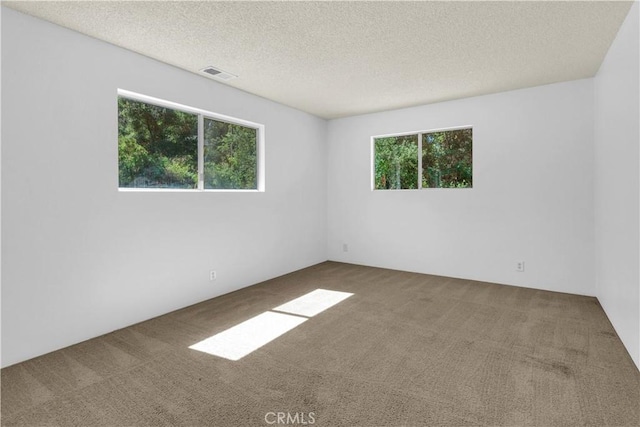7650 Cristobal Ave, Atascadero, CA 93422 - carpeted empty room with a textured ceiling