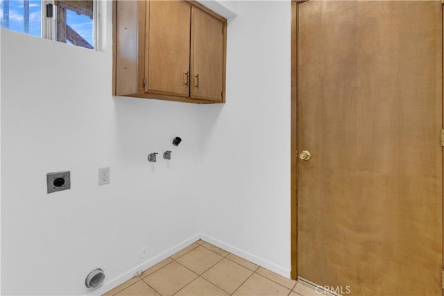 7650 Cristobal Ave, Atascadero, CA 93422 - washroom featuring cabinet space, electric dryer hookup, hookup for a washing machine, and light tile patterned floors