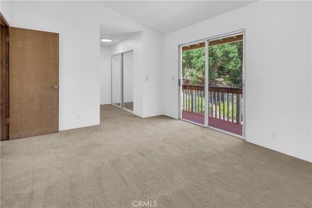 7650 Cristobal Ave, Atascadero, CA 93422 - empty room with carpet floors and vaulted ceiling