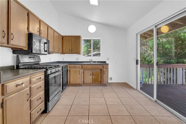 7650 Cristobal Ave, Atascadero, CA 93422 - kitchen featuring black appliances, lofted ceiling, dark countertops, and light tile patterned floors