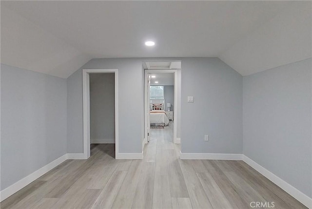 805 Earlham St, Pasadena, CA 91101 - additional living space featuring baseboards, lofted ceiling, and light wood-style floors