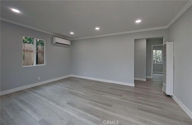 805 Earlham St, Pasadena, CA 91101 - spare room featuring crown molding, wood finished floors, baseboards, an AC wall unit, and recessed lighting