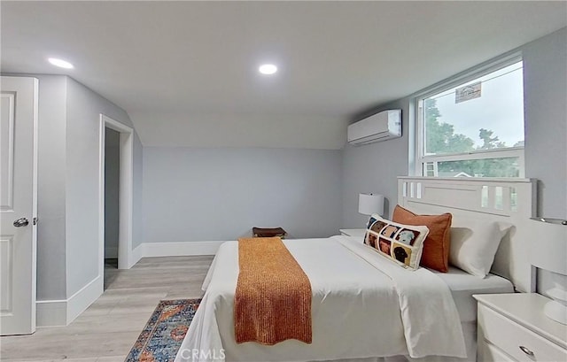 805 Earlham St, Pasadena, CA 91101 - bedroom with a wall unit AC, lofted ceiling, recessed lighting, baseboards, and light wood-style flooring
