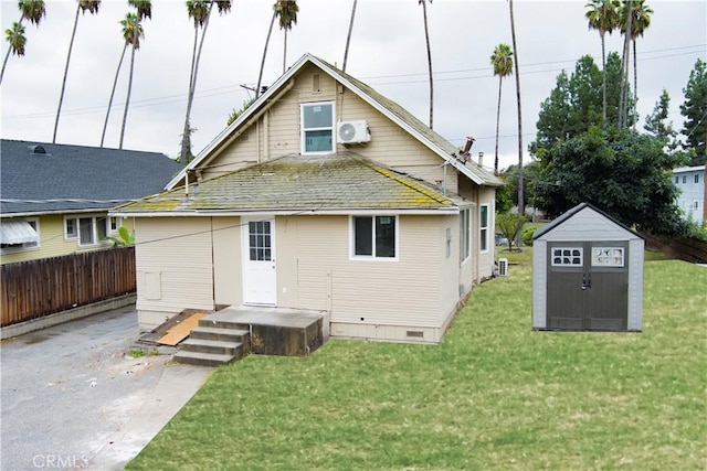 805 Earlham St, Pasadena, CA 91101 - rear view of house featuring an outdoor structure, a yard, a shed, and fence