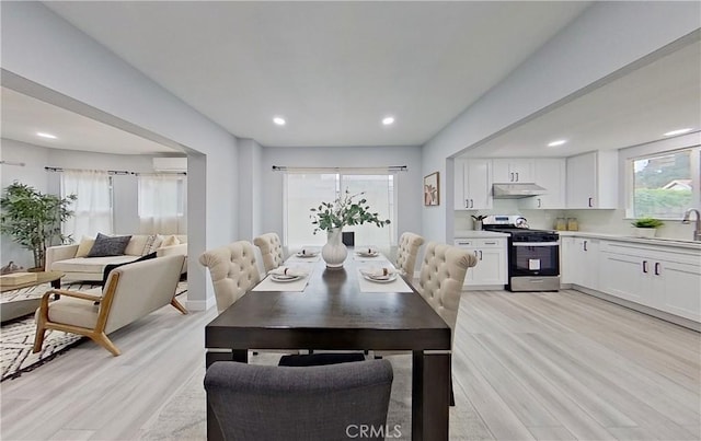 805 Earlham St, Pasadena, CA 91101 - dining area featuring a wall mounted AC, light wood-style flooring, and recessed lighting