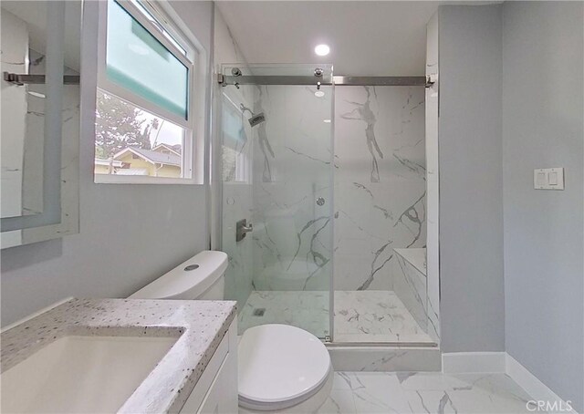 805 Earlham St, Pasadena, CA 91101 - bathroom featuring marble finish floor, baseboards, toilet, and a marble finish shower