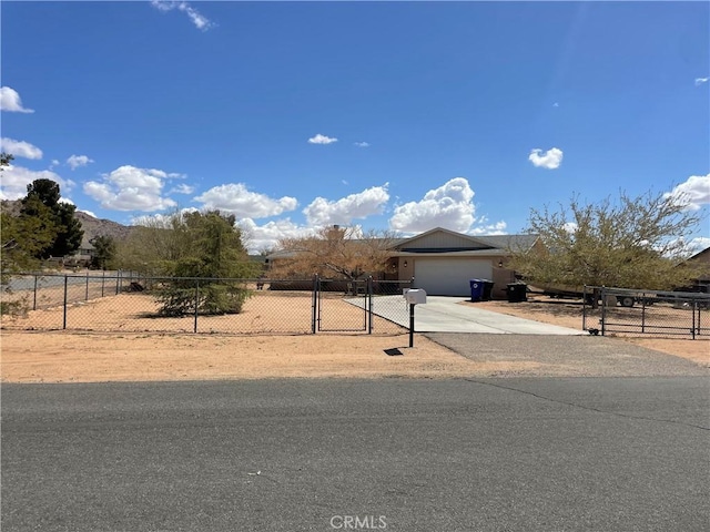 16633 Neenach Rd, Apple Valley, CA 92307 - view of property hidden behind natural elements with a garage, driveway, and a fenced front yard