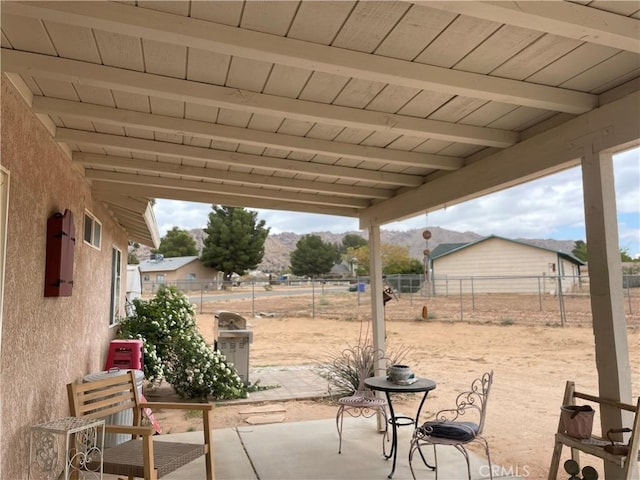 view of patio with a fenced backyard and grilling area