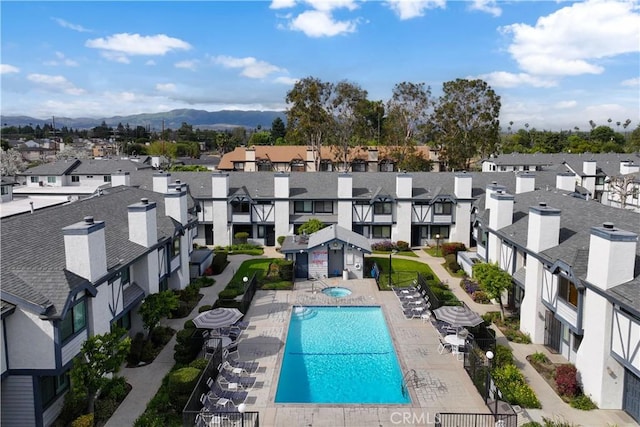 19231 Sherman Way Unit 44, Reseda, CA 91335 - view of pool featuring a residential view, a patio, and a mountain view