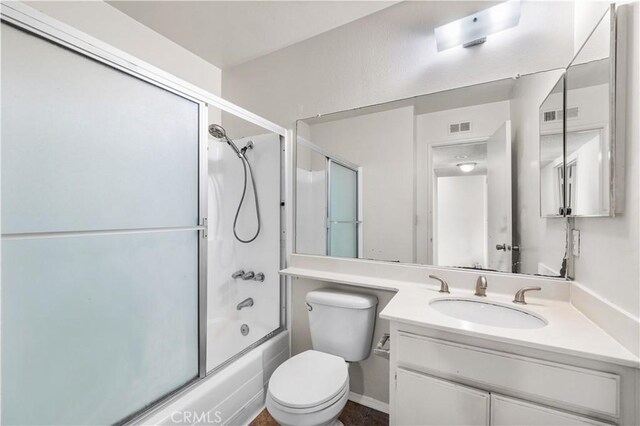 19231 Sherman Way Unit 44, Reseda, CA 91335 - bathroom with visible vents, toilet, bath / shower combo with glass door, and vanity