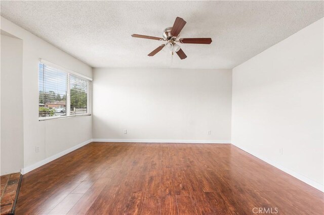 19231 Sherman Way Unit 44, Reseda, CA 91335 - spare room with a textured ceiling, baseboards, ceiling fan, and wood finished floors