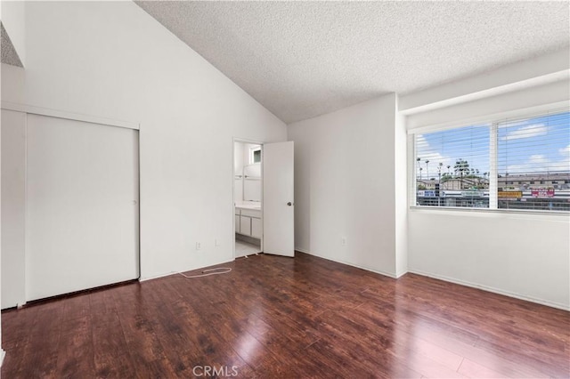 19231 Sherman Way Unit 44, Reseda, CA 91335 - unfurnished bedroom with a textured ceiling, ensuite bathroom, vaulted ceiling, and wood finished floors