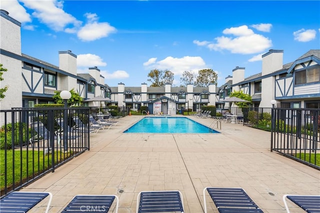 19231 Sherman Way Unit 44, Reseda, CA 91335 - pool featuring a patio area, a residential view, and fence
