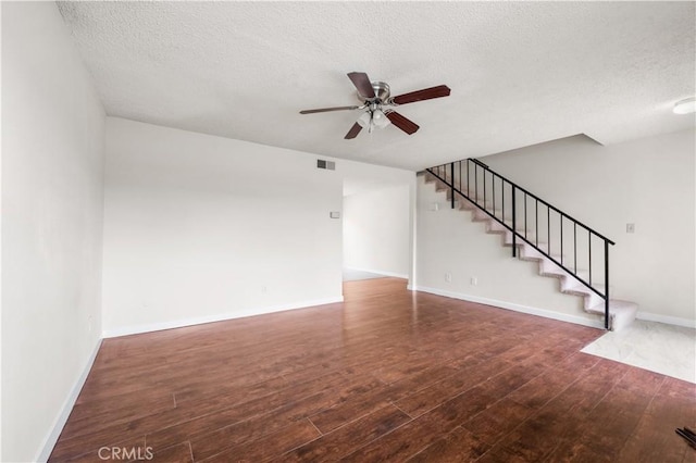 19231 Sherman Way Unit 44, Reseda, CA 91335 - unfurnished living room with stairs, wood-type flooring, a textured ceiling, ceiling fan, and visible vents