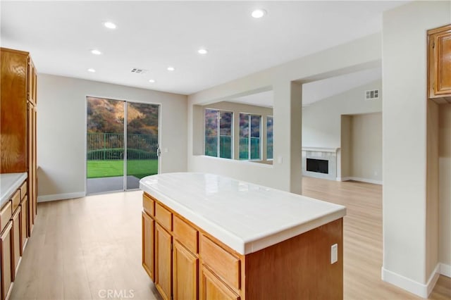 kitchen featuring plenty of natural light, recessed lighting, light wood-style flooring, and visible vents