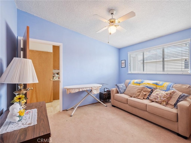9160 Ox Bow Rd, Lucerne Valley, CA 92356 - living area featuring carpet floors, a textured ceiling, lofted ceiling, and a ceiling fan