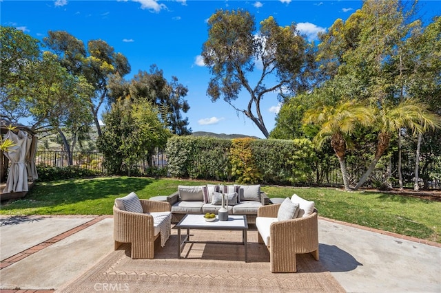 view of patio / terrace with fence and an outdoor hangout area