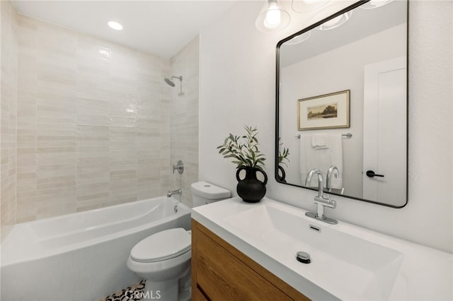 full bath featuring recessed lighting, vanity, bathtub / shower combination, and toilet