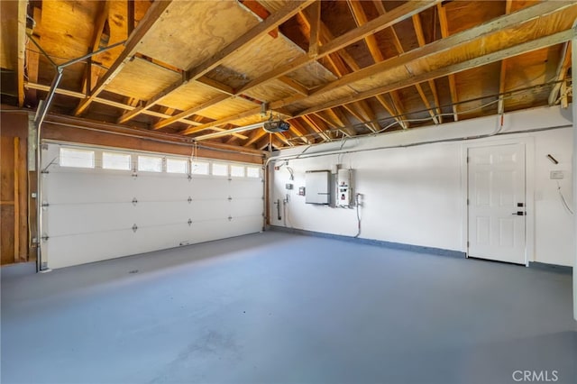 garage with a garage door opener and water heater