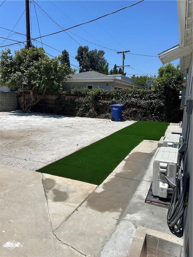 view of yard with fence and a patio area