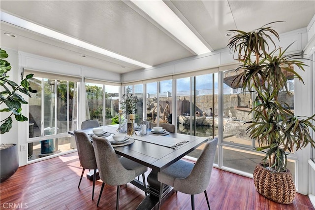 sunroom featuring wood finished floors