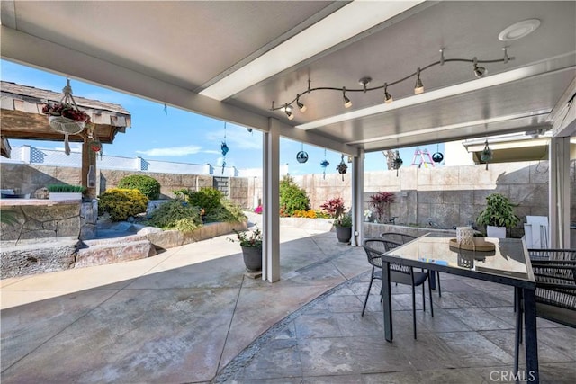 view of patio / terrace with a fenced backyard and outdoor dining area