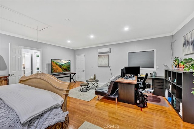 bedroom featuring attic access, wood finished floors, a wall mounted air conditioner, and crown molding