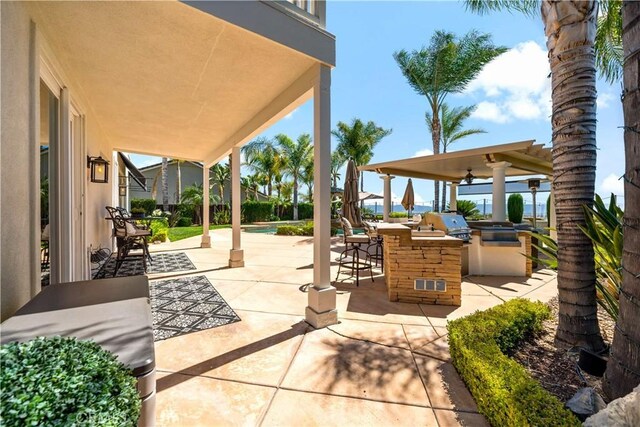 38925 Cherry Point Ln, Murrieta, CA 92563 - view of patio / terrace featuring grilling area, a gazebo, a bar, and exterior kitchen