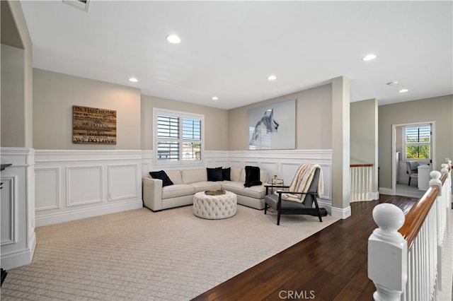 38925 Cherry Point Ln, Murrieta, CA 92563 - living area with dark wood-style floors, recessed lighting, a wainscoted wall, and a healthy amount of sunlight