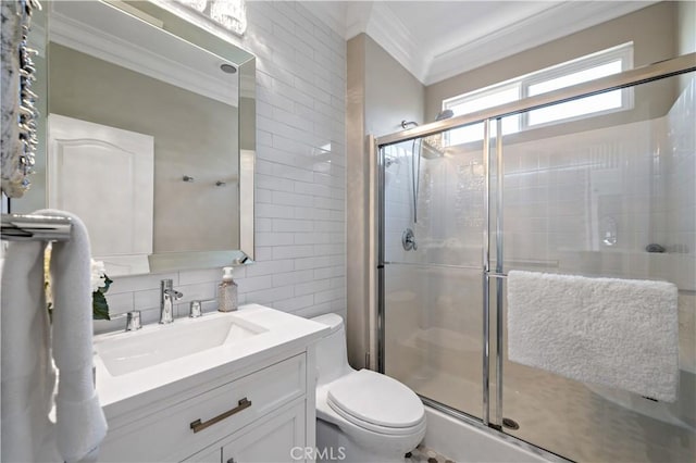 38925 Cherry Point Ln, Murrieta, CA 92563 - bathroom with a stall shower, toilet, ornamental molding, tile walls, and vanity