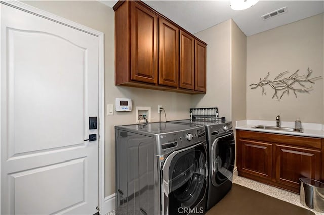 38925 Cherry Point Ln, Murrieta, CA 92563 - laundry area with visible vents, washer and dryer, cabinet space, and a sink