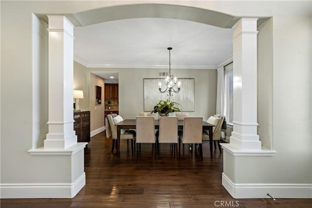 38925 Cherry Point Ln, Murrieta, CA 92563 - dining room featuring ornate columns, ornamental molding, dark wood-style floors, and baseboards