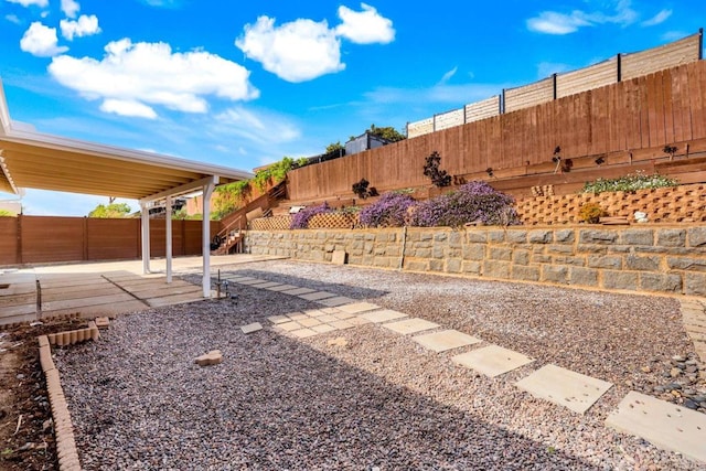 view of yard featuring a fenced backyard and a patio