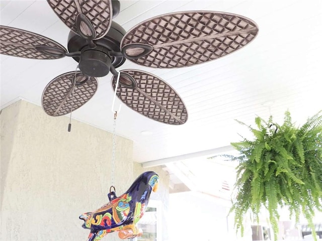 interior details featuring a ceiling fan