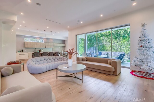 737 N Cherokee Ave, Los Angeles, CA 90038 - living area with light wood-style flooring and recessed lighting